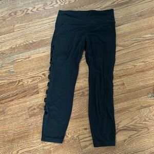 Black Athleta 7/8 leggings with cutout design size M